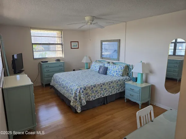 a bedroom with a bed and a chair