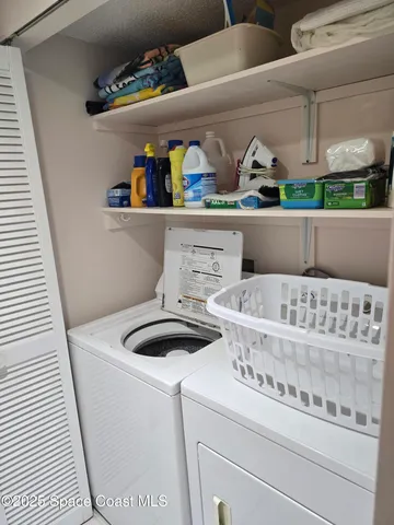 a view of a room that has a bed and a window