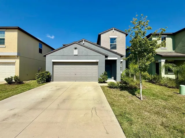 a front view of a house with yard