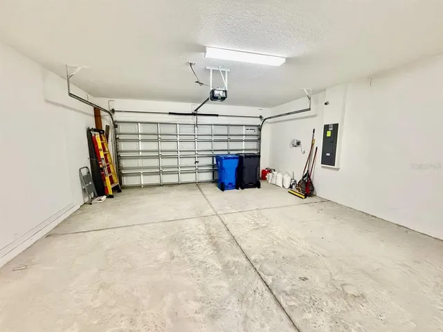a kitchen with granite countertop stainless steel appliances a stove sink microwave and cabinets