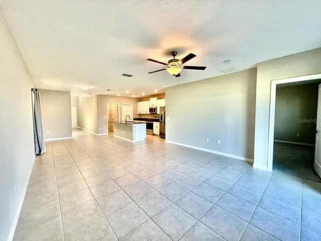 a view of a kitchen with a sink and a window