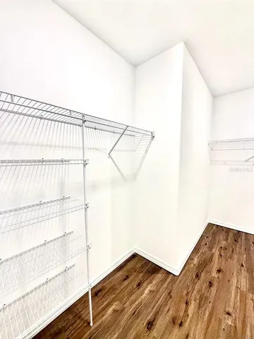 a view of wooden floor in a white cabinet