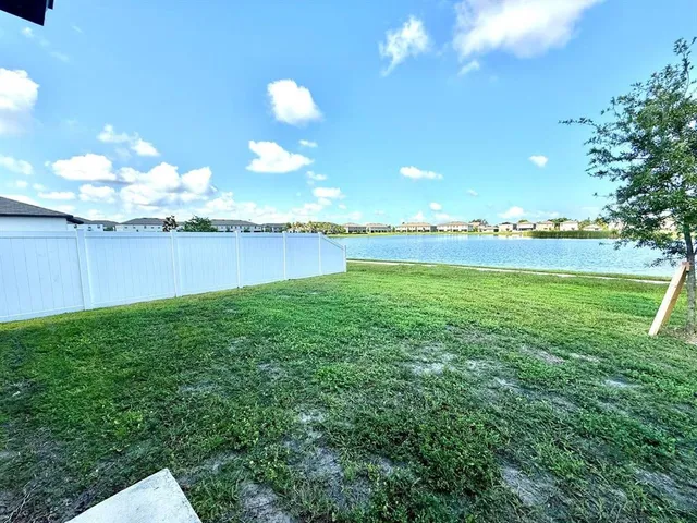 a view of a golf course with a lake view