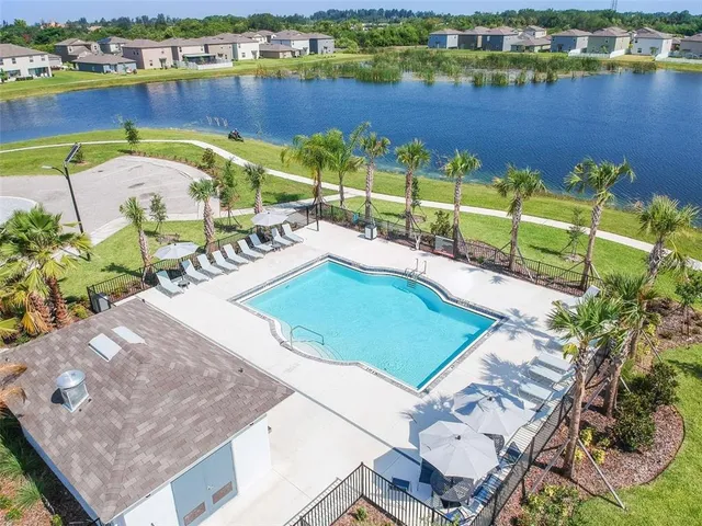 a view of a backyard with sitting area and furniture