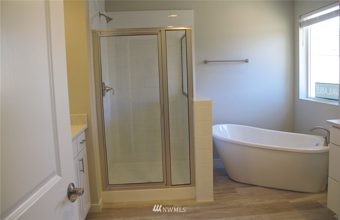 112 215th Street Southeast Bothell, WA 98021 - Photo 8 of 8 a bathroom with a bathtub and shower
