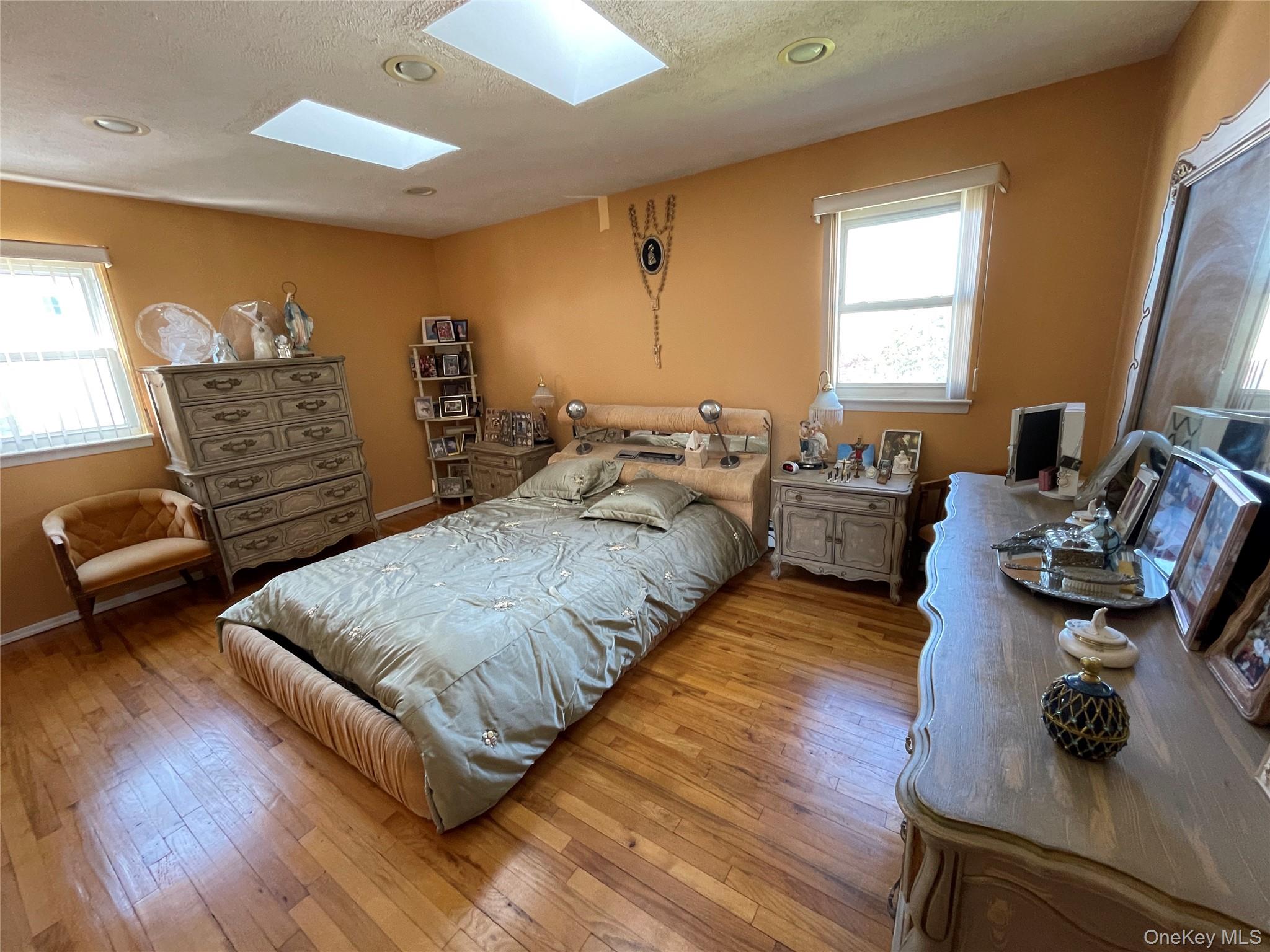 84 Surf Road Lindenhurst, NY 11757 - Photo 11 of 31 a living room with furniture and a couch