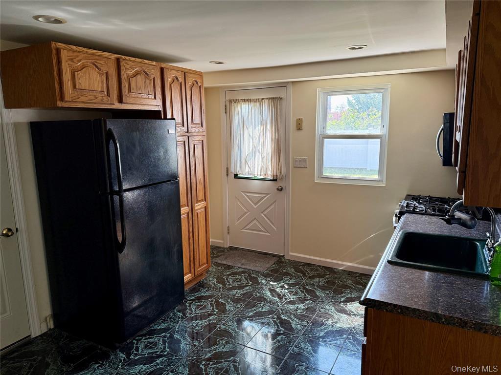 84 Surf Road Lindenhurst, NY 11757 - Photo 16 of 31 a room with storage and utility