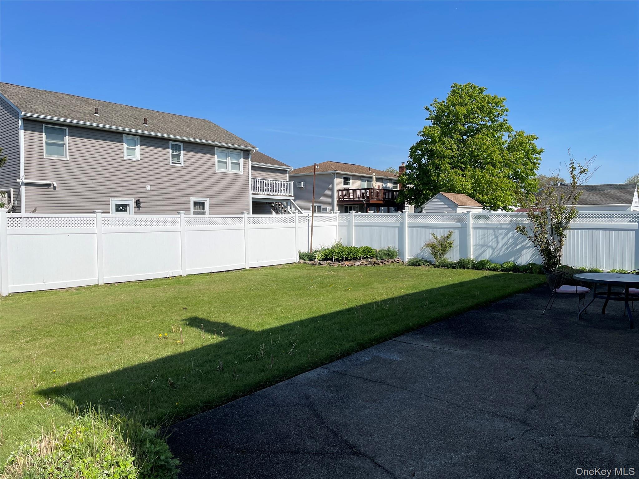 84 Surf Road Lindenhurst, NY 11757 - Photo 25 of 31 a front view of house with yard and green space