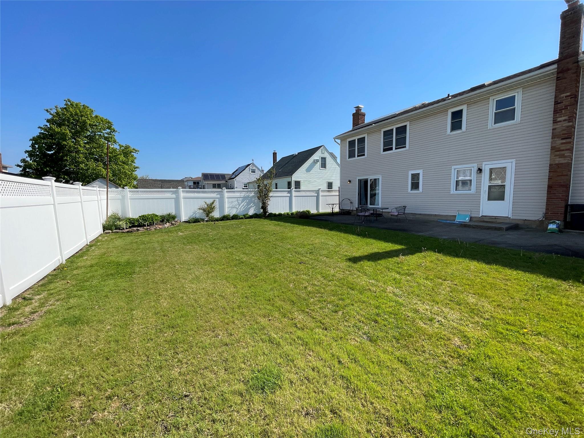 84 Surf Road Lindenhurst, NY 11757 - Photo 27 of 31 a front view of a house with a yard