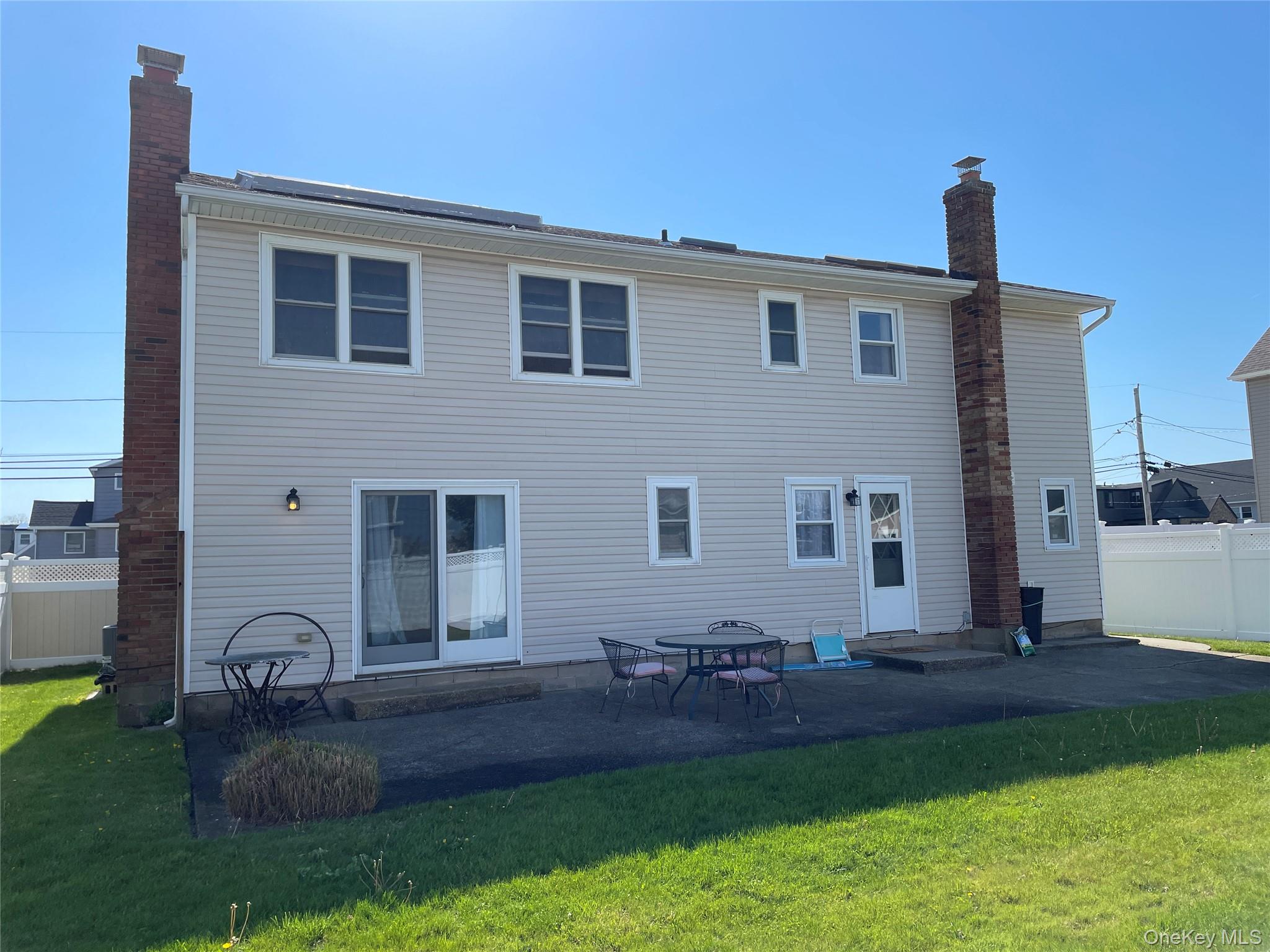 84 Surf Road Lindenhurst, NY 11757 - Photo 28 of 31 a front view of a house with garden