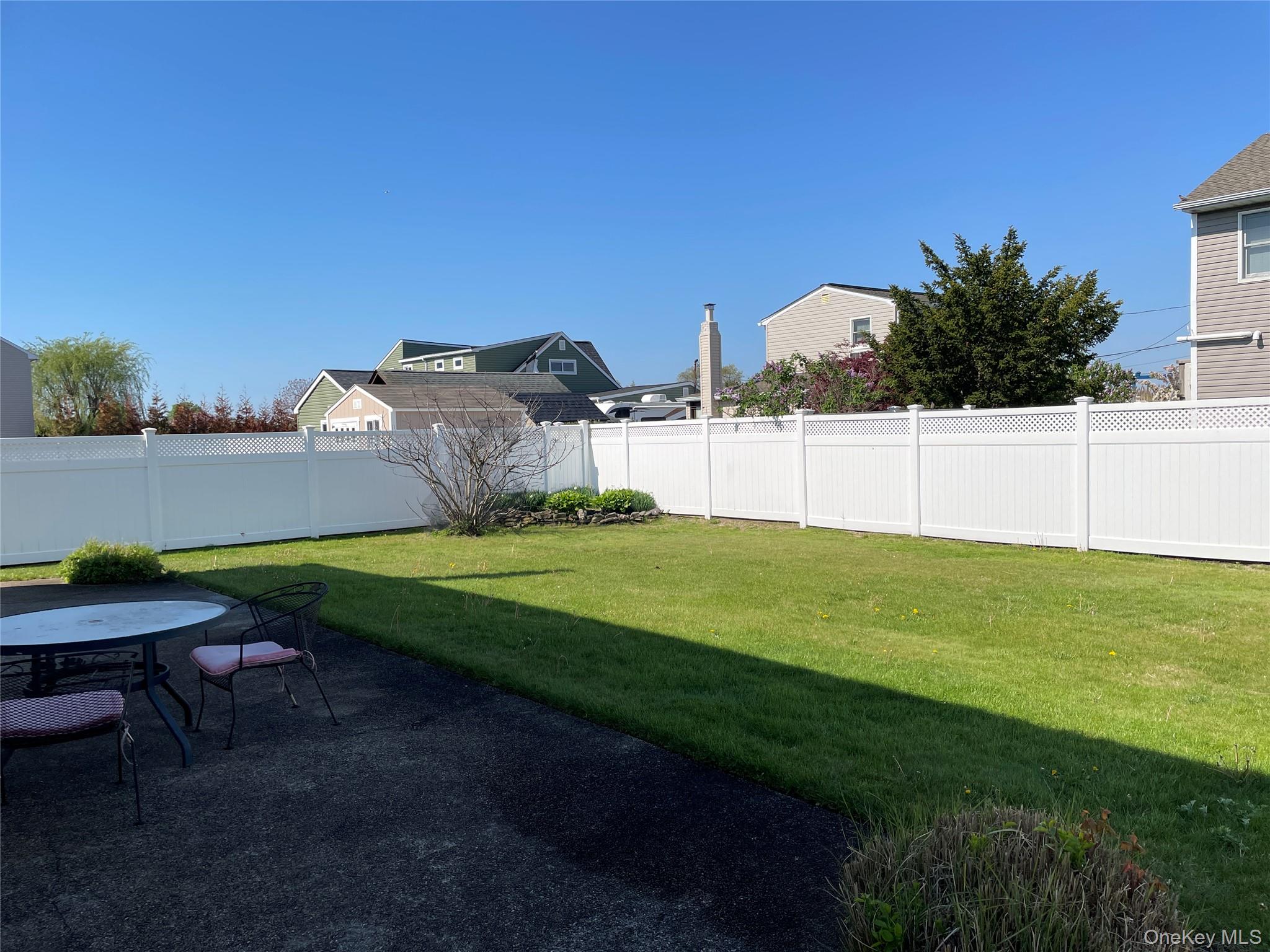 84 Surf Road Lindenhurst, NY 11757 - Photo 29 of 31 a view of a green field with clear sky