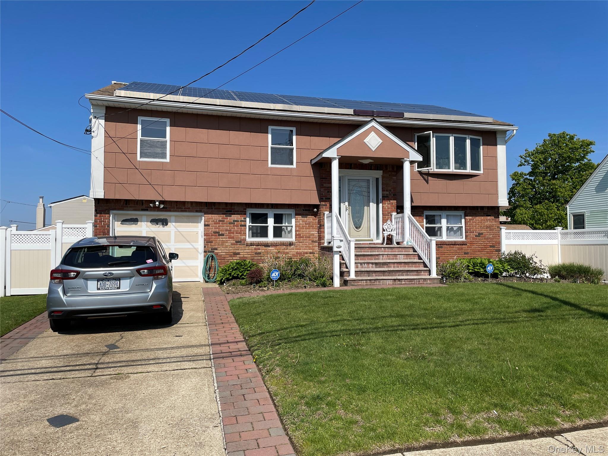 84 Surf Road Lindenhurst, NY 11757 - Photo 31 of 31 a house view with a garden space