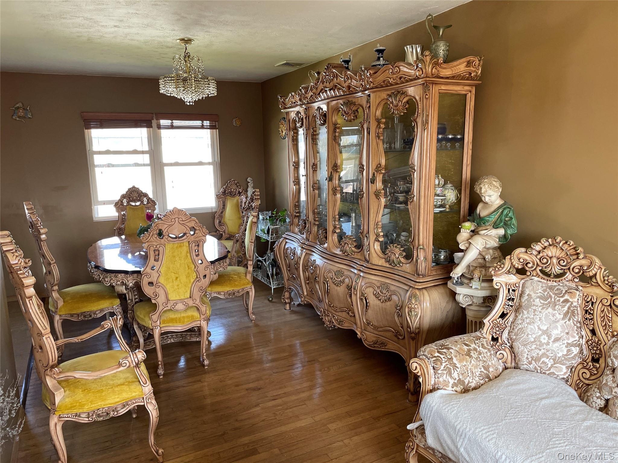84 Surf Road Lindenhurst, NY 11757 - Photo 7 of 31 a living room with furniture and wooden floor