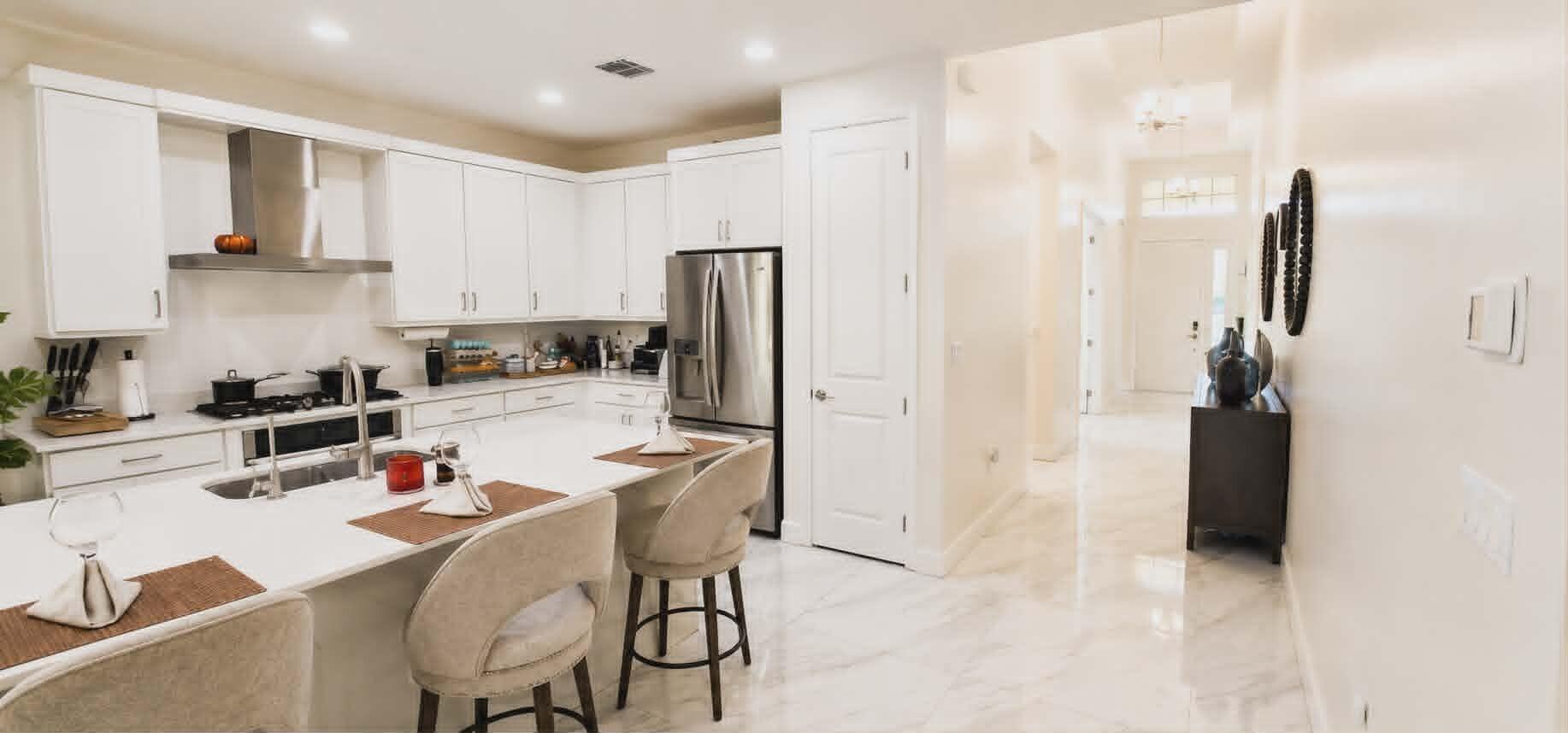 19179 Rolling Acrs Road Loxahatchee, FL 33470 - Photo 8 of 38 a kitchen with stainless steel appliances a refrigerator and a stove top oven