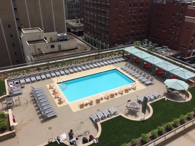 545 North Dearborn Street, Unit 1506 Chicago, IL 60654 - Photo 12 of 15 a kitchen with a stove and a microwave