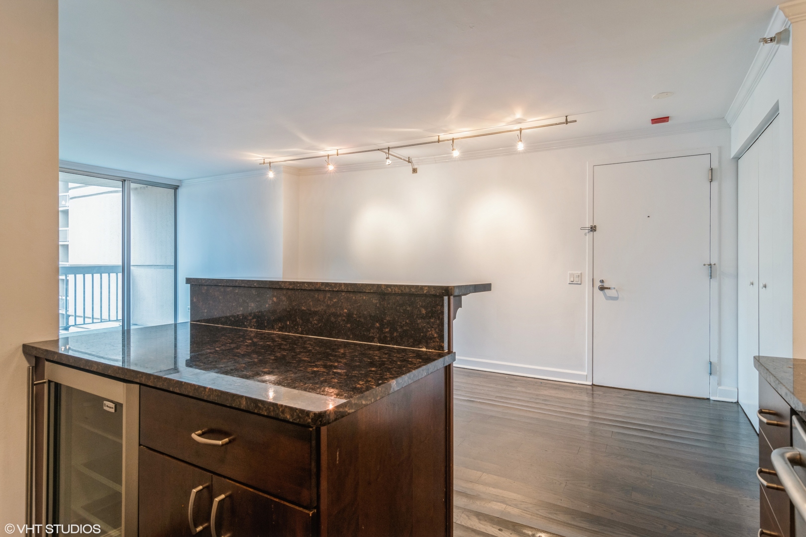 545 North Dearborn Street, Unit 1506 Chicago, IL 60654 - Photo 6 of 15 a living room with hard wood floors and a sink