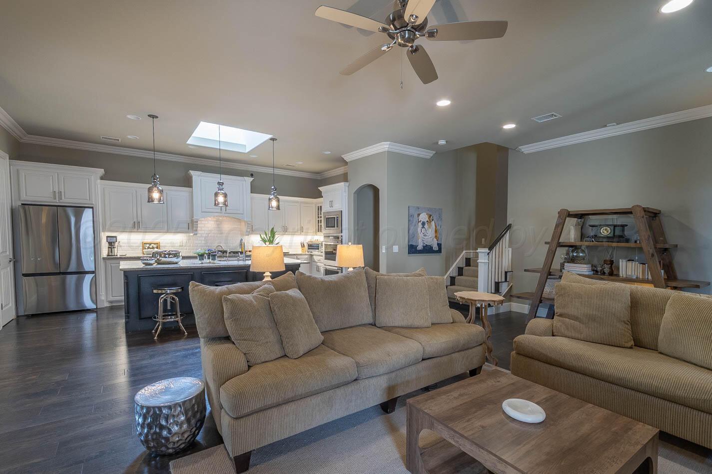 6809 Baccus Amarillo, TX 79124 - Photo 12 of 20 a living room with furniture and a view of kitchen