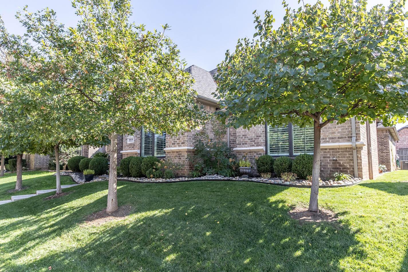 6809 Baccus Amarillo, TX 79124 - Photo 19 of 20 front view of a house with a yard