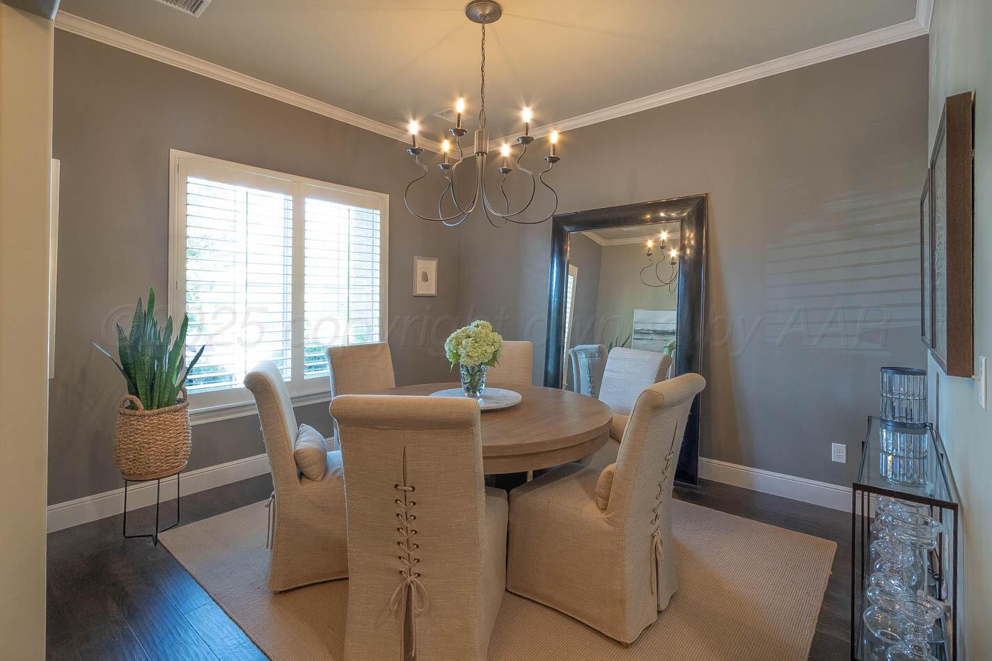 6809 Baccus Amarillo, TX 79124 - Photo 4 of 20 a dining room with furniture potted plants and wooden floor