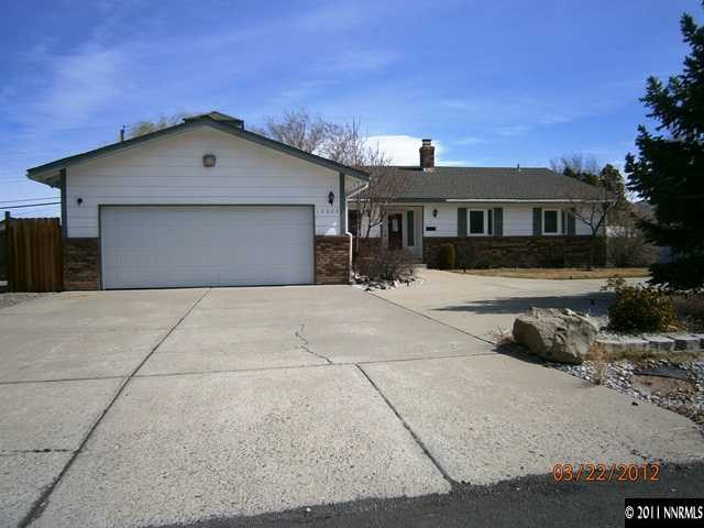 12025 Broken Hill Road Reno, NV 89511 - Photo 1 of 1 a front view of a house with a yard and garage