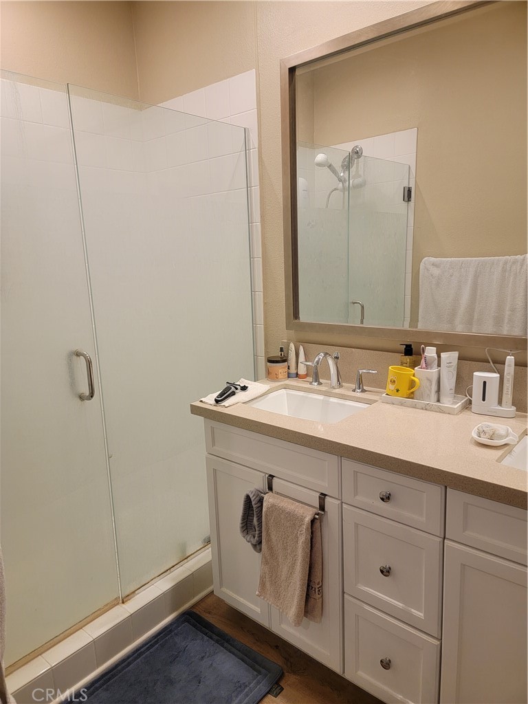8014 Ackerman Street Buena Park, CA 90621 - Photo 12 of 16 a bathroom with a sink a vanity and a mirror