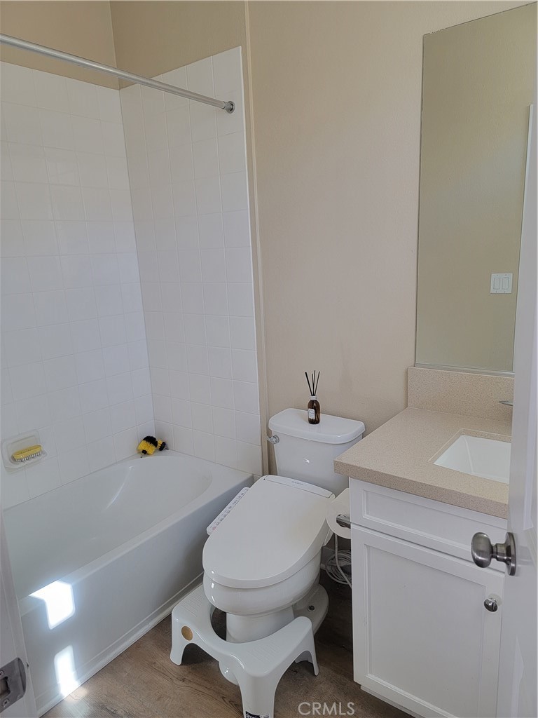 8014 Ackerman Street Buena Park, CA 90621 - Photo 14 of 16 a bathroom with a sink a toilet and shower