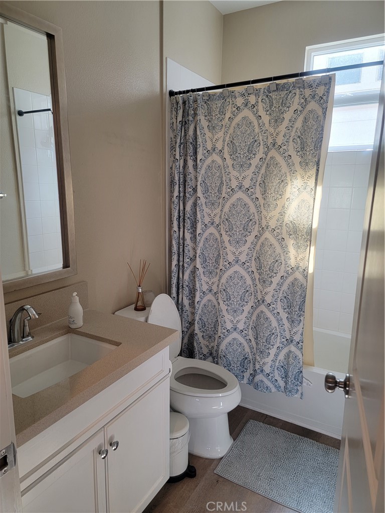 8014 Ackerman Street Buena Park, CA 90621 - Photo 8 of 16 a bathroom with a sink and a mirror