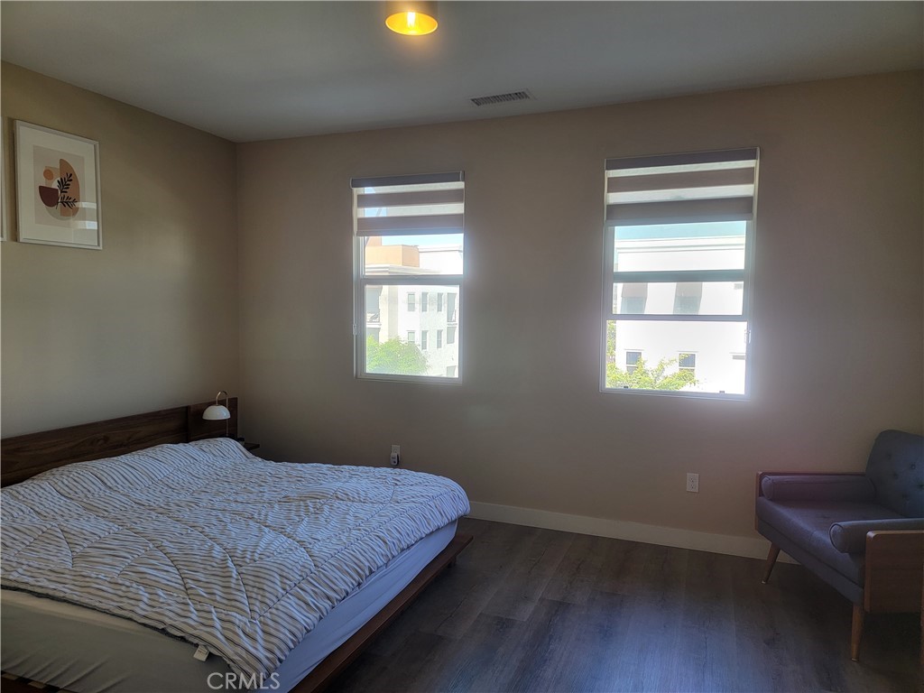 8014 Ackerman Street Buena Park, CA 90621 - Photo 9 of 16 a bedroom with bed and window
