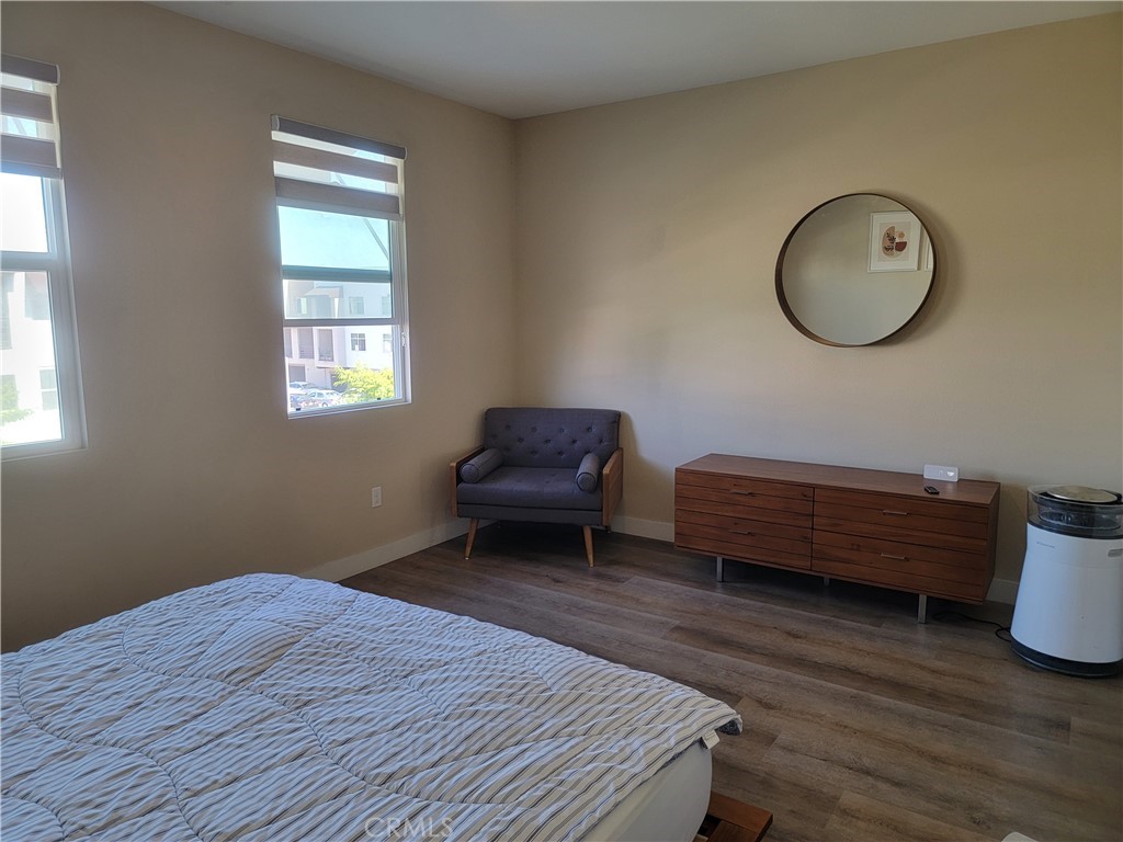 8014 Ackerman Street Buena Park, CA 90621 - Photo 10 of 16 a room with a bed and a mirror