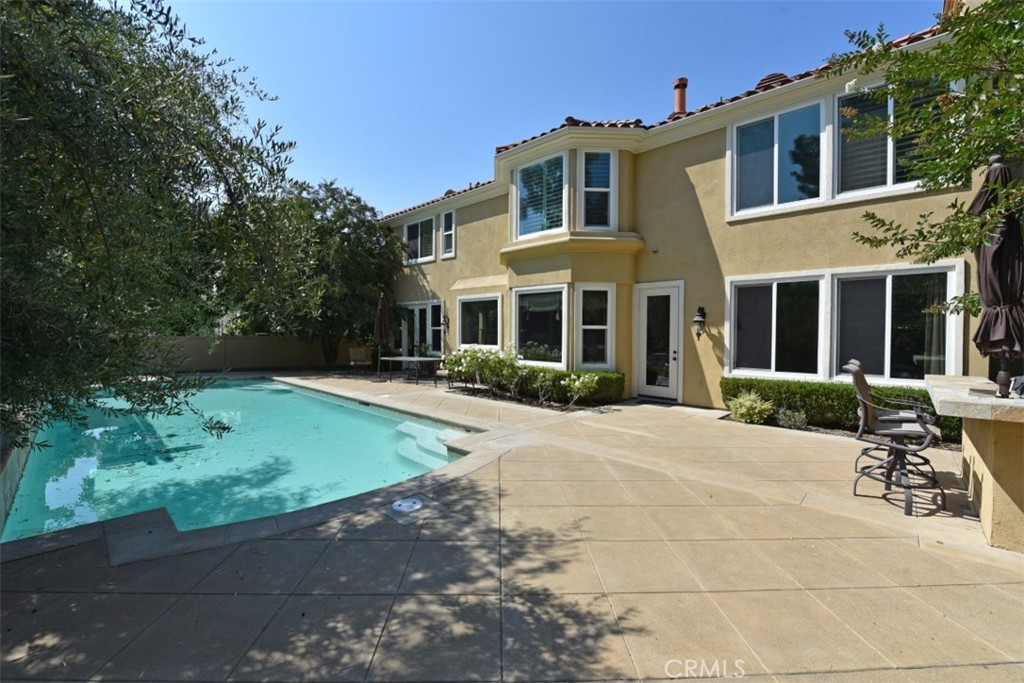12 Brigadier Irvine, CA 92603 - Photo 33 of 50 a front view of a house with garden and trees