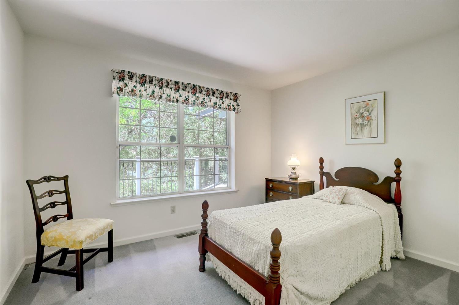 16479 Brewer Road Grass Valley, CA 95949 - Photo 12 of 33 a bedroom with a bed chair and window