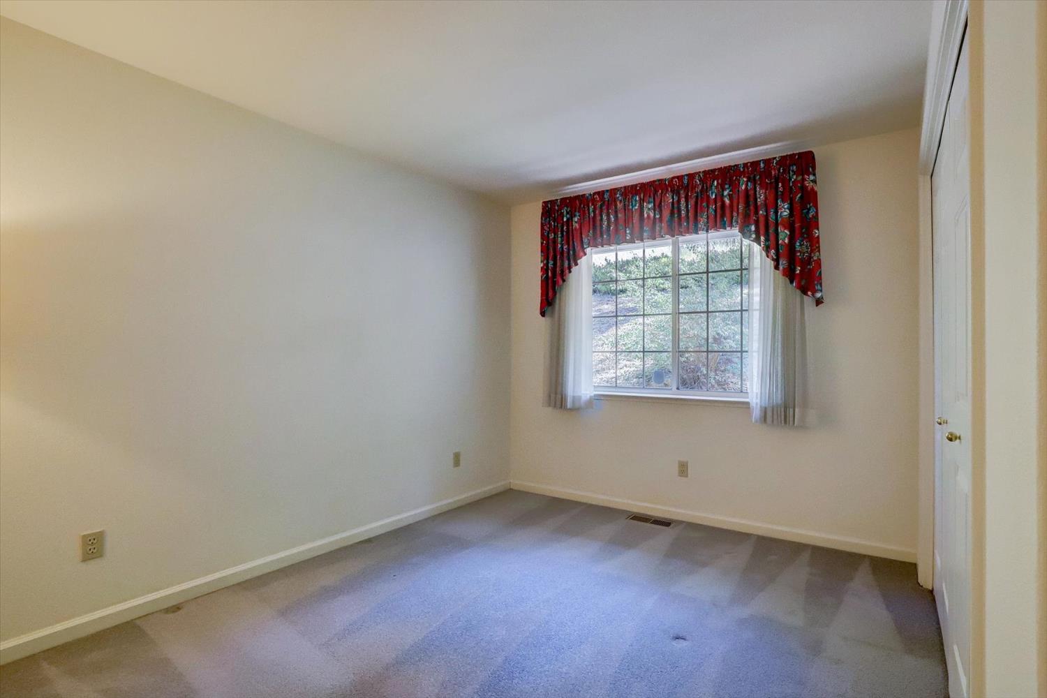 16479 Brewer Road Grass Valley, CA 95949 - Photo 15 of 33 an empty room with a window