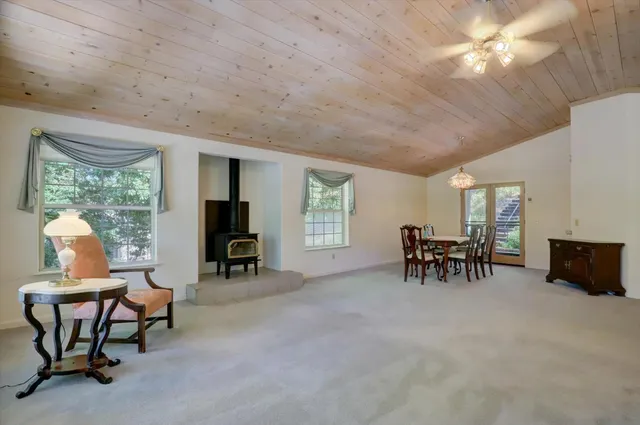 a view of a livingroom with furniture and a flat screen tv