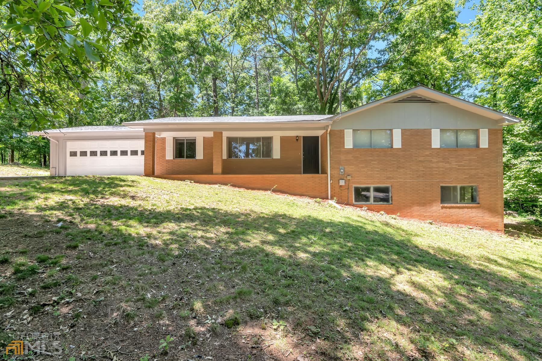 203 Clarks Bridge Road Gainesville, GA 30501 - Photo 1 of 1 a front view of a house with yard