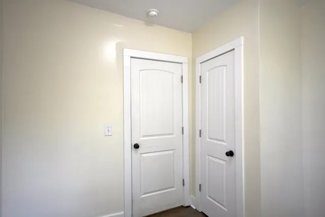 a view of a hallway with closet area