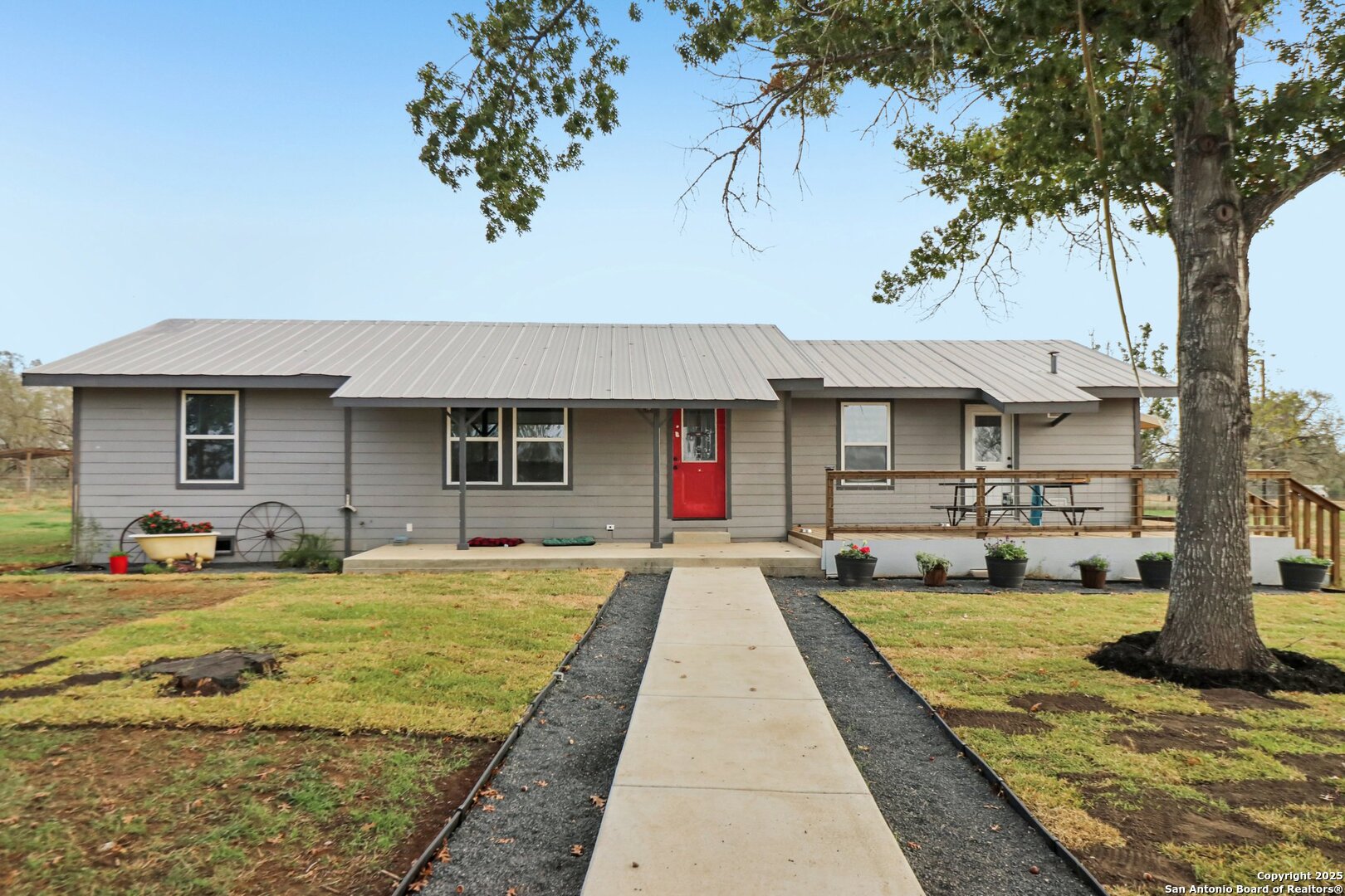 a view of a house with swimming pool and sitting area
