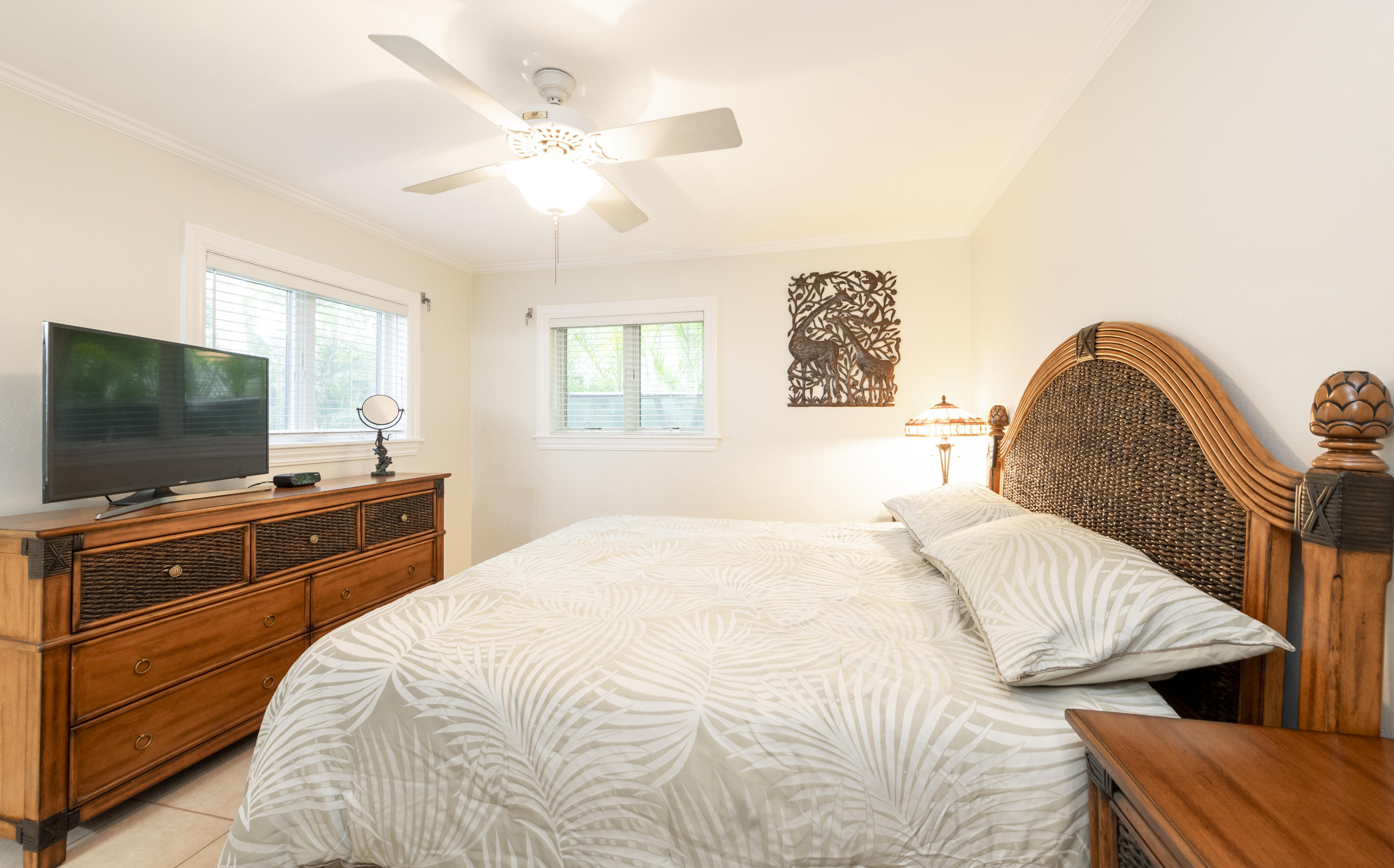 14 Bamboo Terrace Key Haven, FL 33040 - Photo 12 of 32 a bedroom with a bed and a flat screen tv