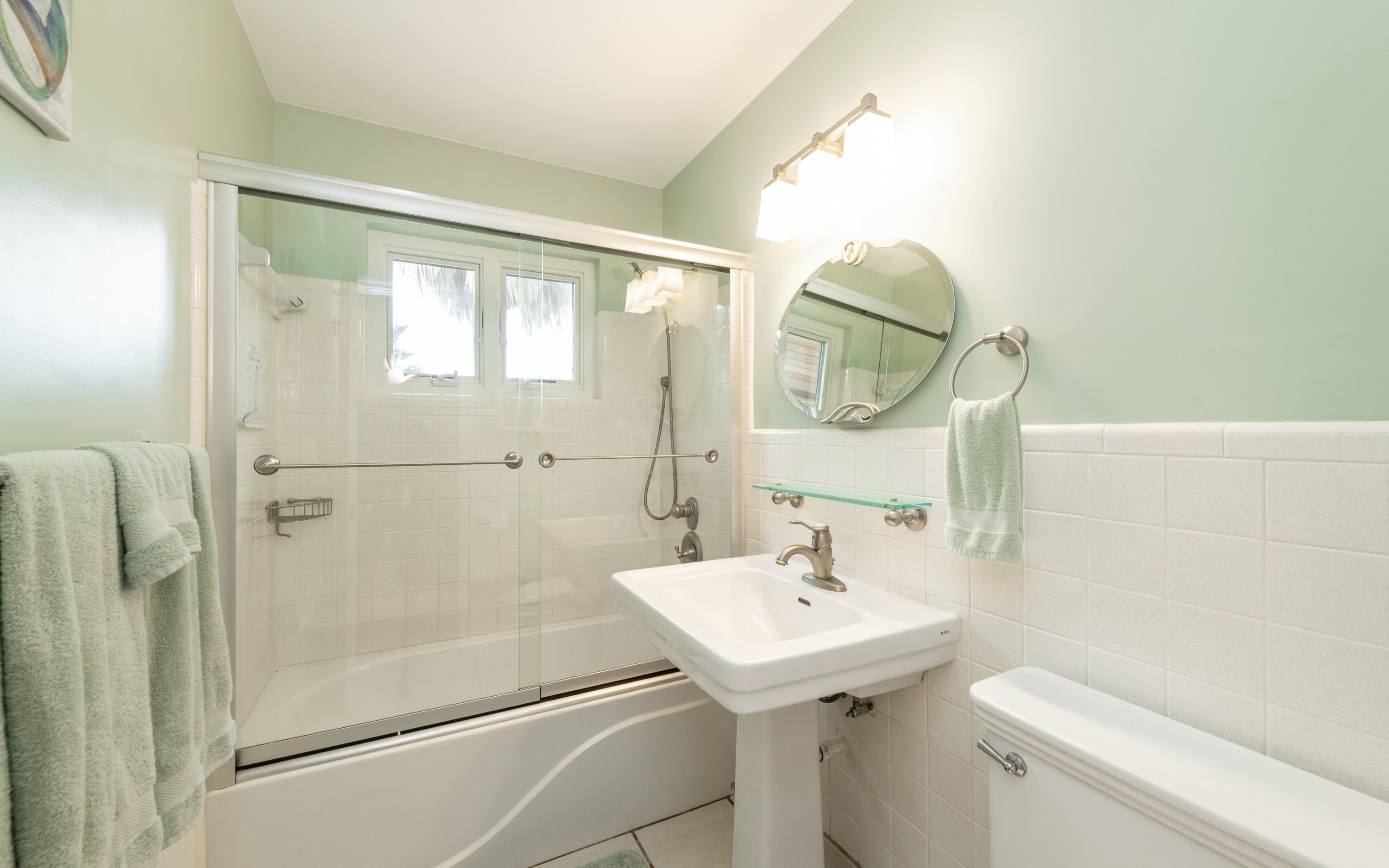 14 Bamboo Terrace Key Haven, FL 33040 - Photo 16 of 32 a bathroom with a sink a mirror and a toilet