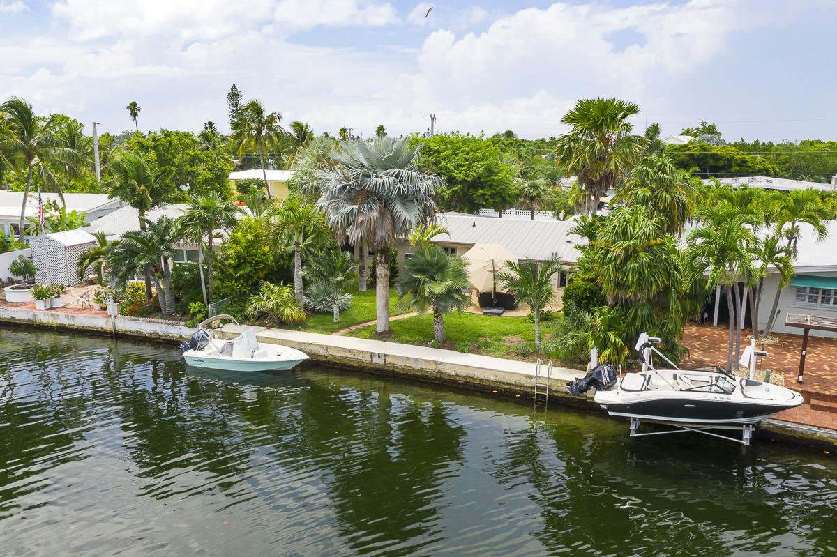 14 Bamboo Terrace Key Haven, FL 33040 - Photo 2 of 32 a view of a lake with lawn chairs