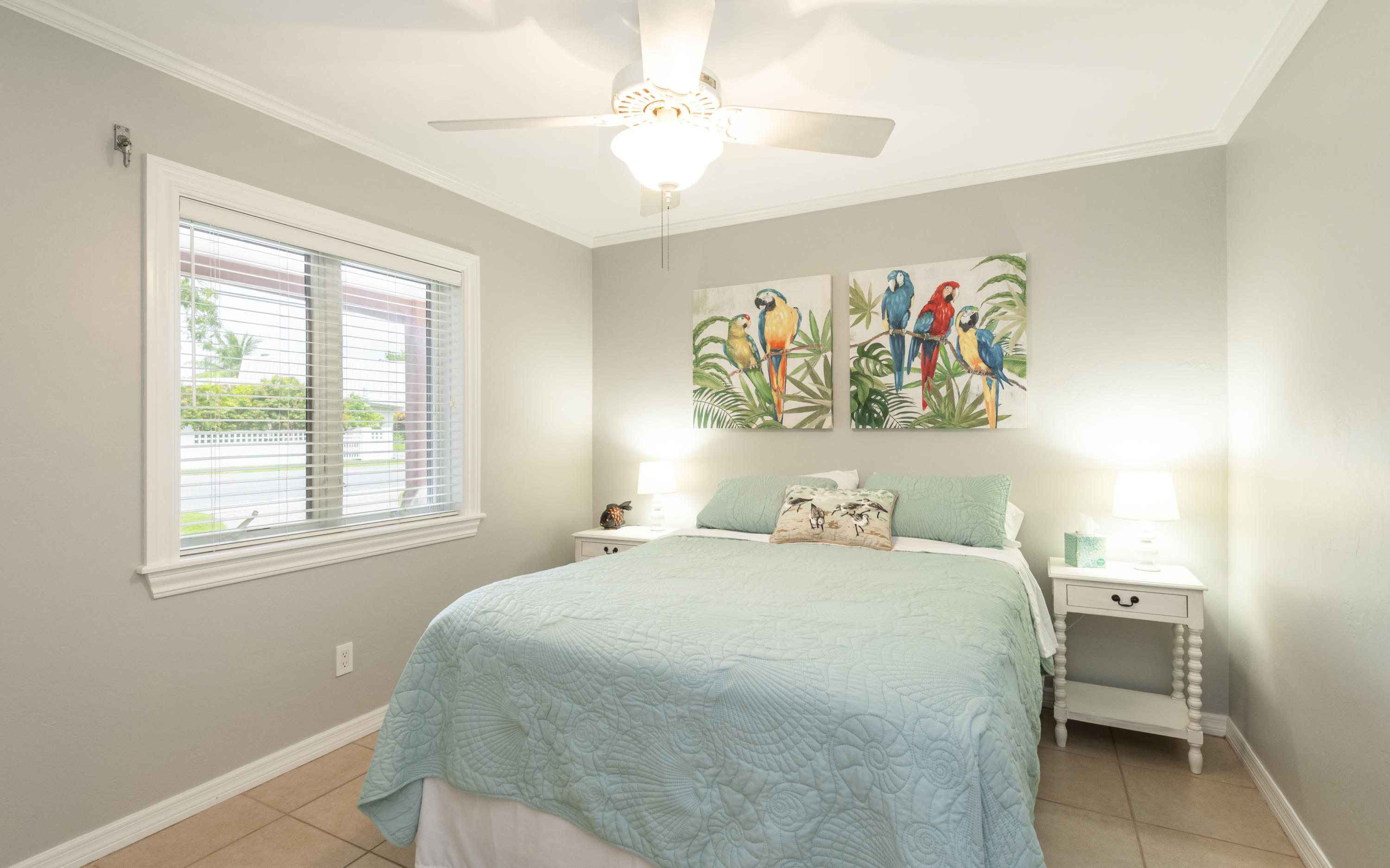 14 Bamboo Terrace Key Haven, FL 33040 - Photo 26 of 32 a bedroom with a bed and a window