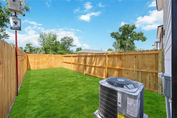 a view of a backyard with sitting area
