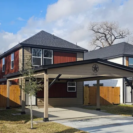 a front view of a house with garage