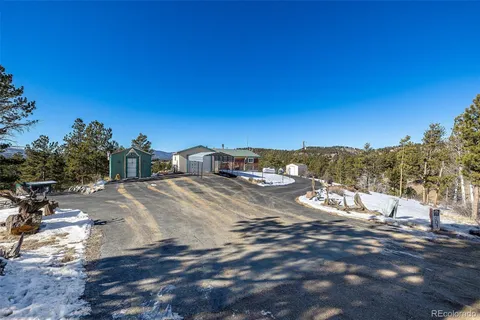 a view of a town with big trees