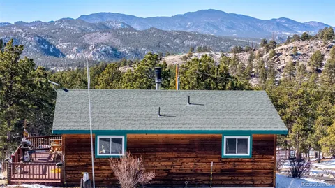 an aerial view of house with a yard