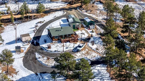 a bird view of house with outdoor space
