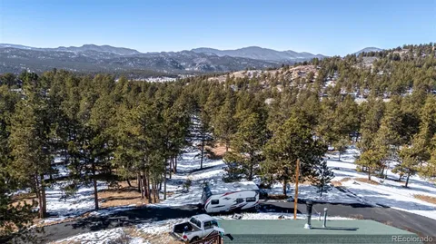 a view of a city with mountains in the background