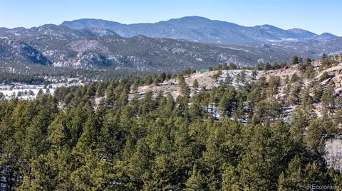 a view of mountains and valleys