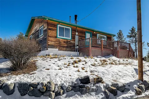 a view of a house with a mountain in the background