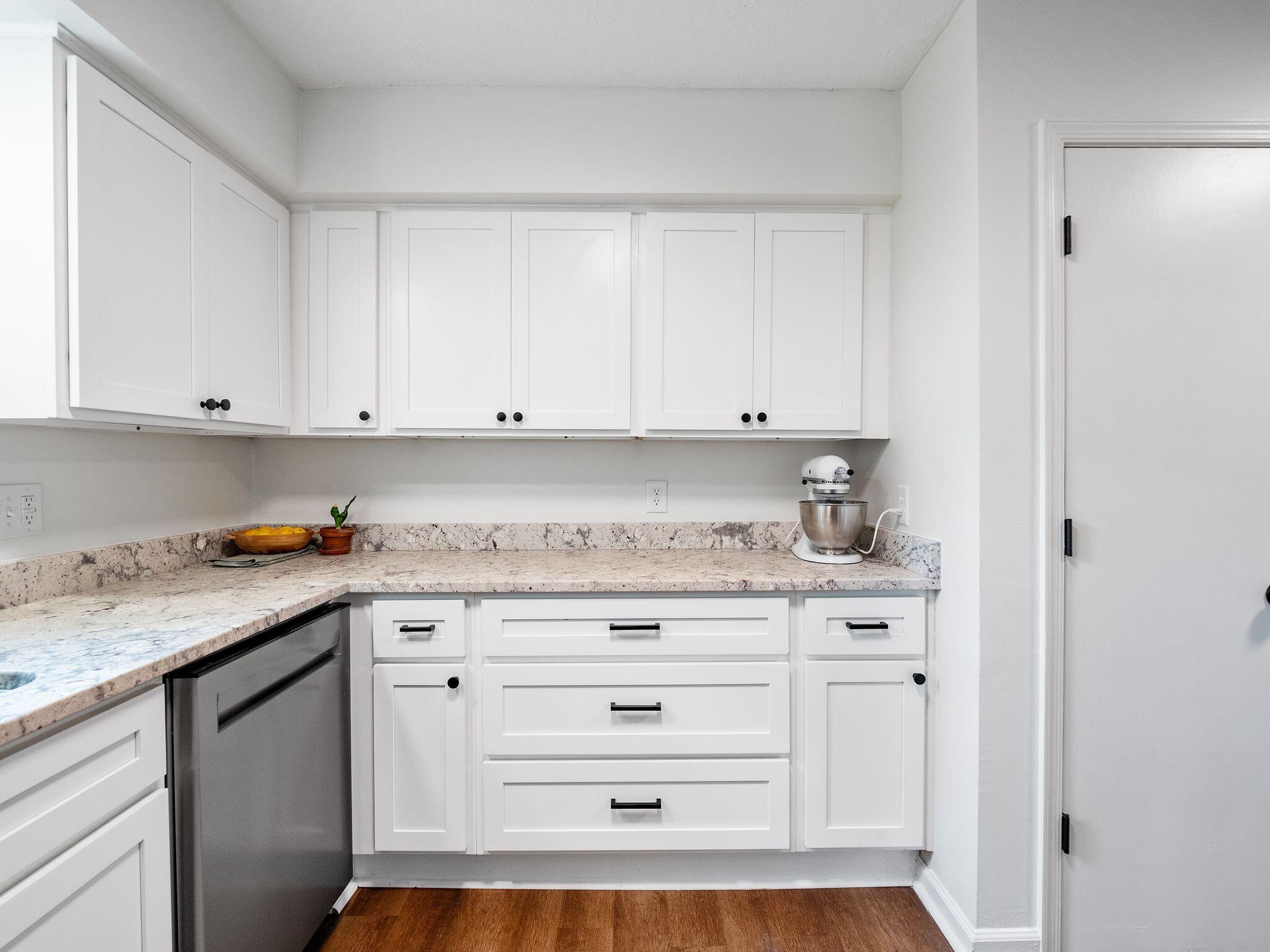 1701 Glendon Road Salem, VA 24153 - Photo 16 of 43 a kitchen with granite countertop white cabinets and white appliances