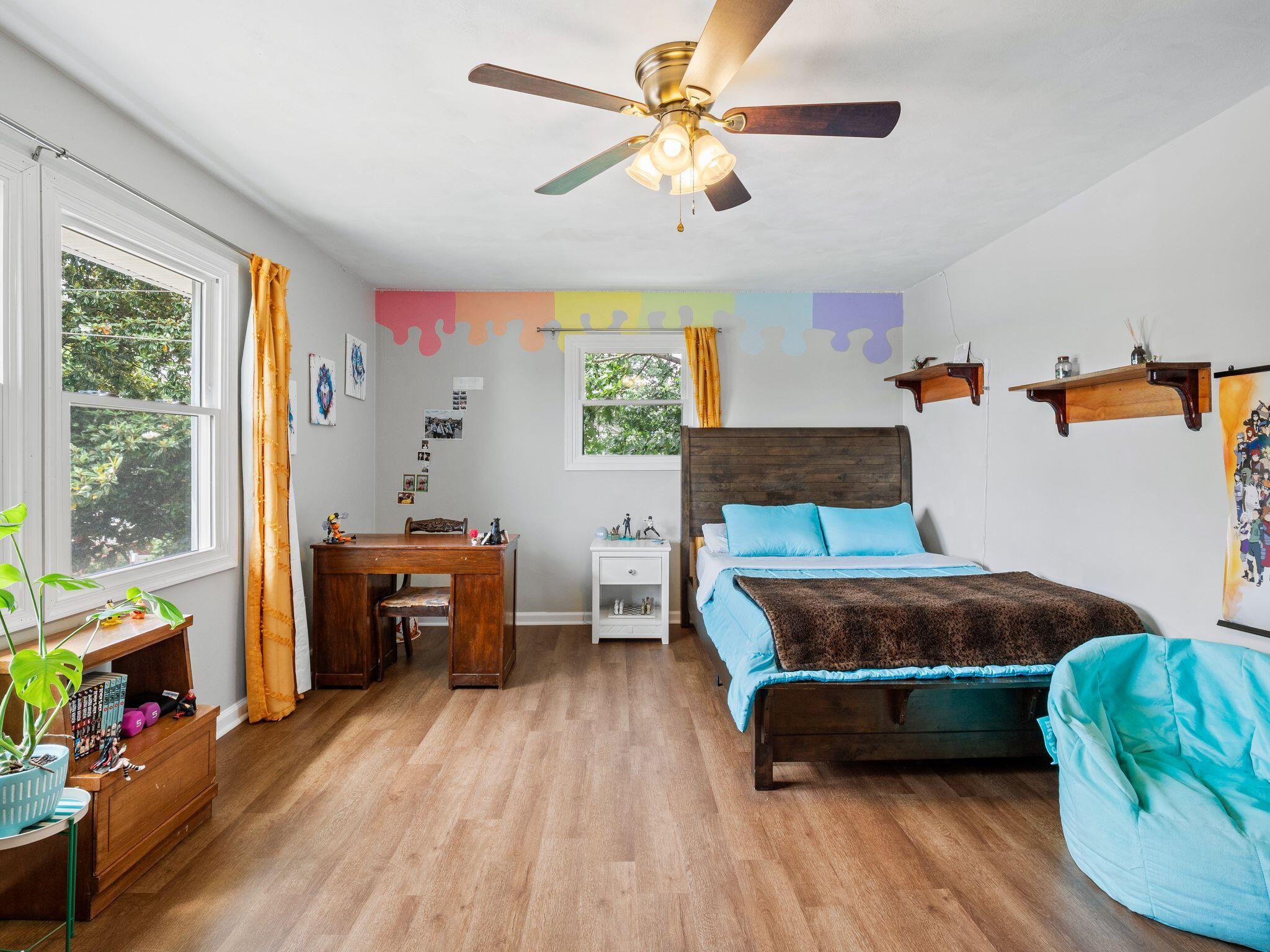 1701 Glendon Road Salem, VA 24153 - Photo 29 of 43 a bedroom with a bed and a chandelier